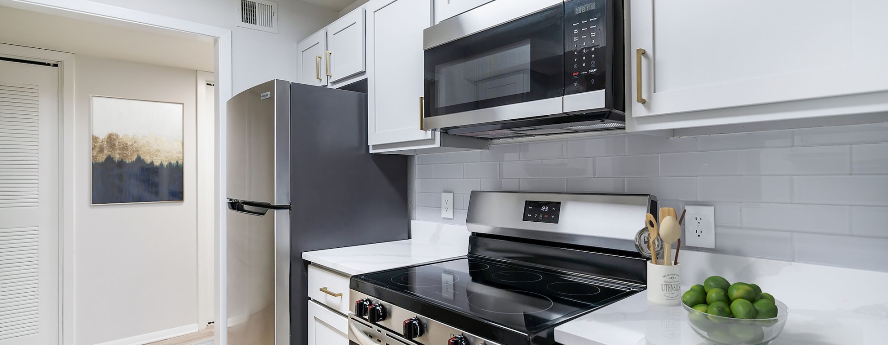 bright kitchen with white cabinets