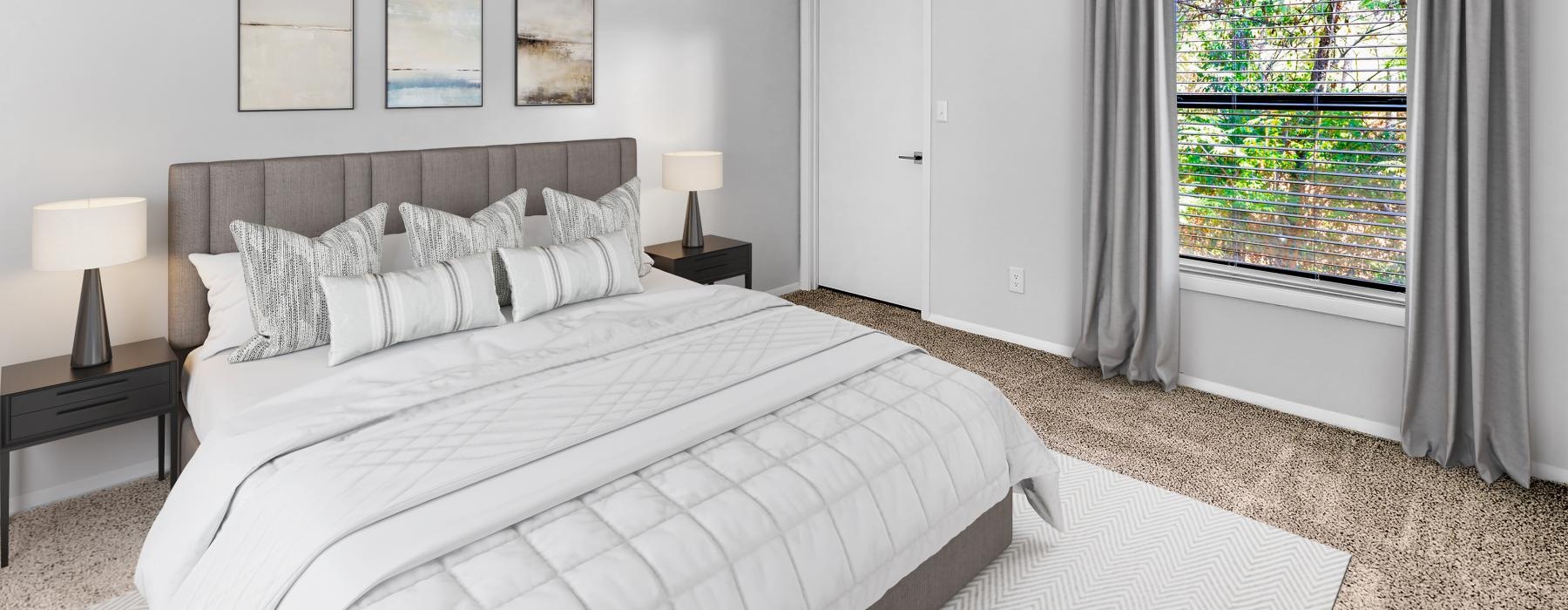 a bedroom with a large window